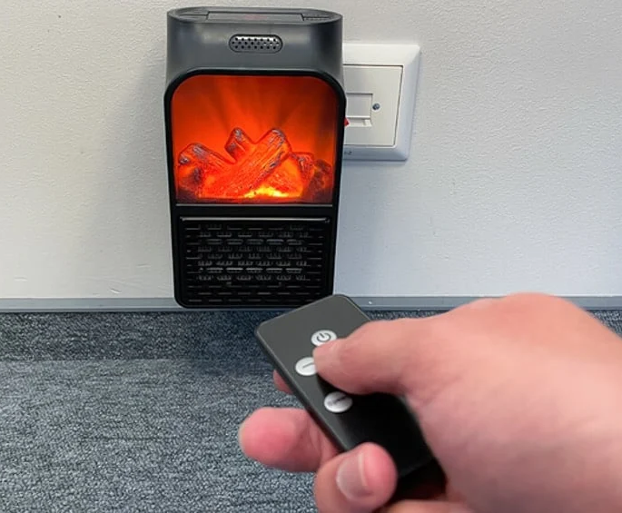 man turning on Slava Heater with remote